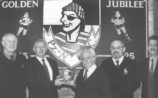Henry Care presents a plaque to Hugh Martin